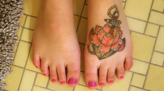 flowers tattoos on feet. Flower tattoos on foot for